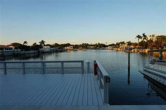 a view of a lake next to a bridge