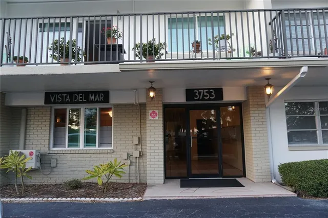 a view of a car park in front of house