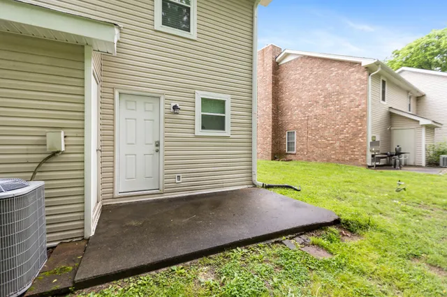a view of a back yard of the house