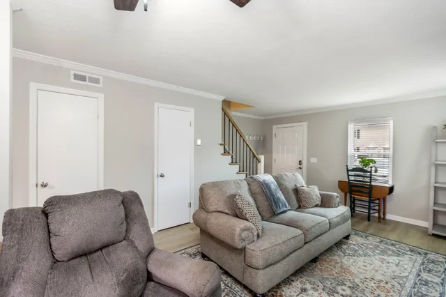 a living room with furniture and a couch