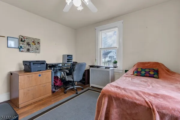 a bedroom with a bed and a table in it