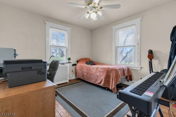 a bed room with a bed and a window