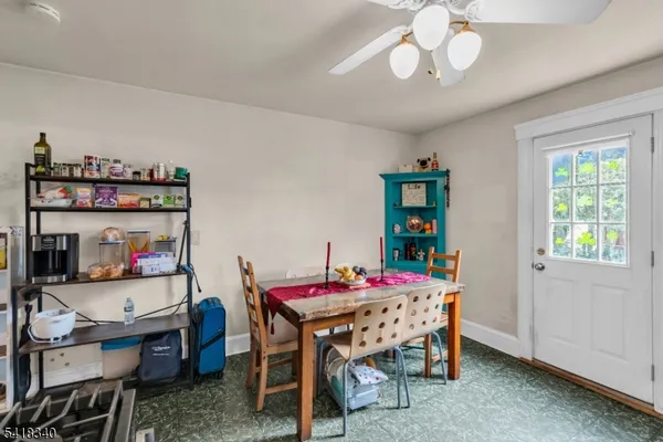 a dining room with a table and chairs in it