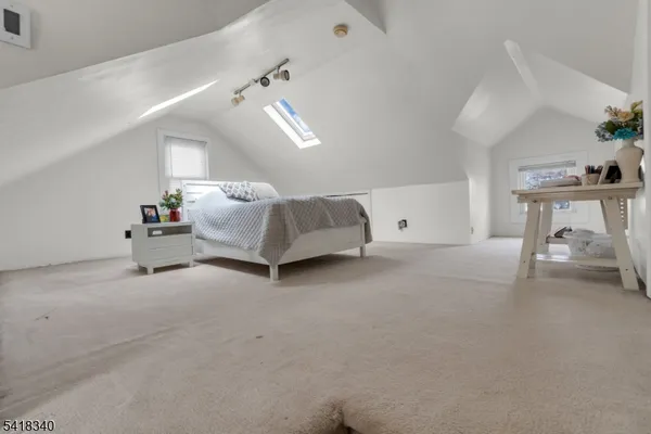 a living room with furniture and a lamp