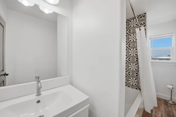 a bathroom with a bathtub and shower
