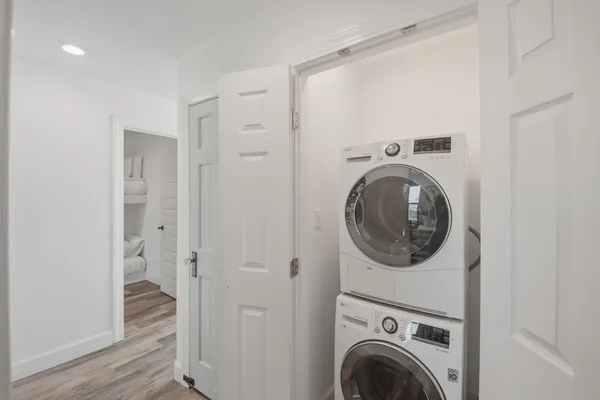 a view of a hallway with washer and dryer