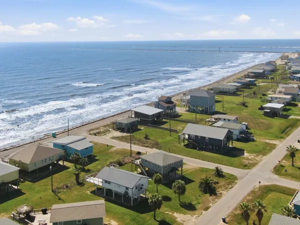 an aerial view of a house with a ocean view