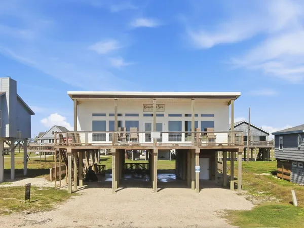 a aerial view of a house with a table and chairs