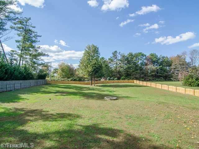 1250 Blackberry Ridge Drive High Point, NC 27265 - Photo 16 of 16 Exterior Back. Endless Possibilities in this Backyard! Can you say Baseball, Soccer Field or Just Room to Romp?