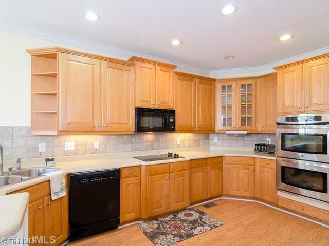 Kitchen. Solid Surface counters, Bar Area, and Double Ovens!