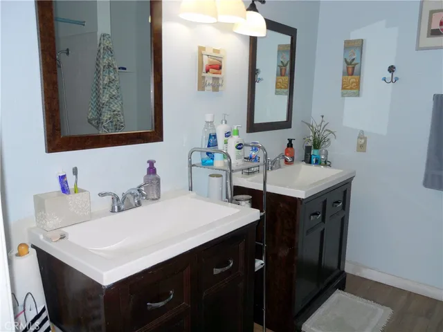 a bathroom with a sink toilet and mirror