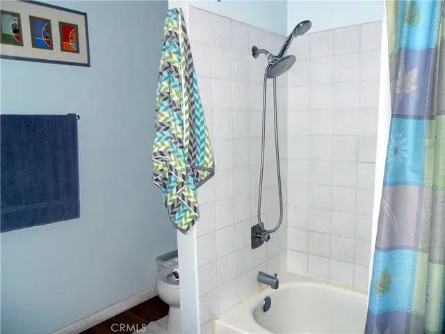 a bathroom with a sink mirror and toilet