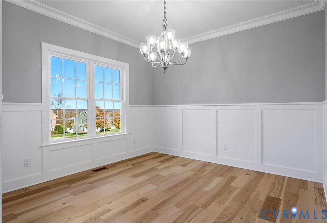 3107 Handley Road Midlothian, VA 23113 - Photo 19 of 50 Formal dining room with hardwood floors, chandelie