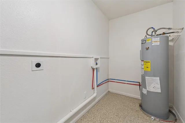 a view of storage and utility room with washer and dryer
