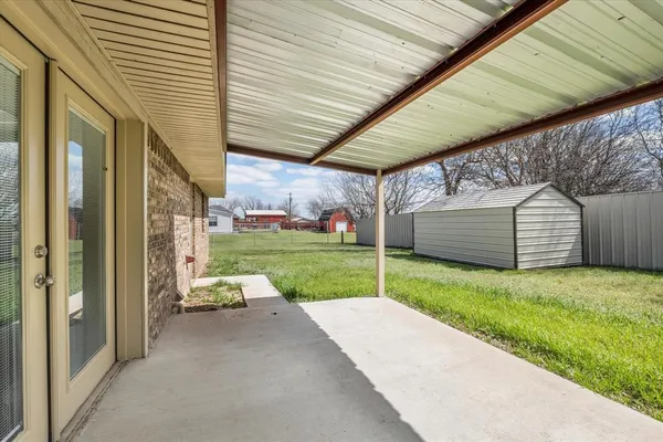a view of backyard with cabin