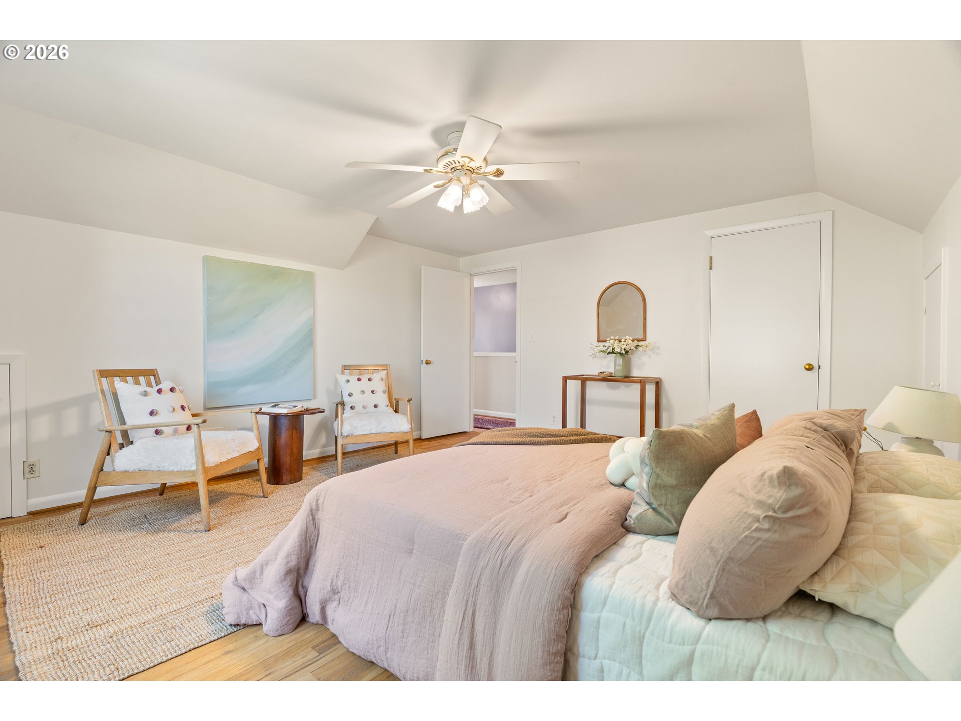 7541 Northeast Alameda Street Portland, OR 97213 - Photo 22 of 35 a bedroom with a bed and a chandelier