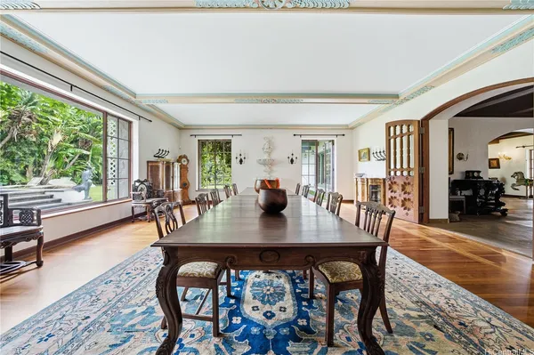 a view of a dining room with furniture window and wooden floor