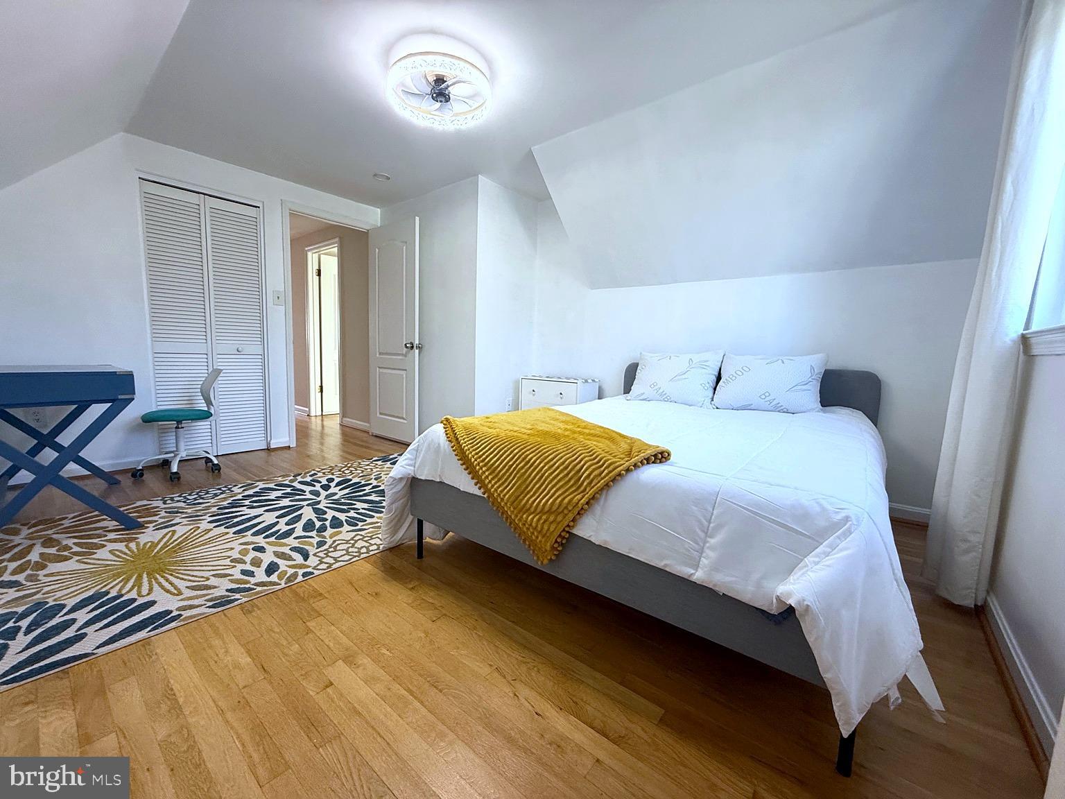 8621 Kenilworth Drive Springfield, VA 22151 - Photo 11 of 21 a bedroom with a bed and wooden floor