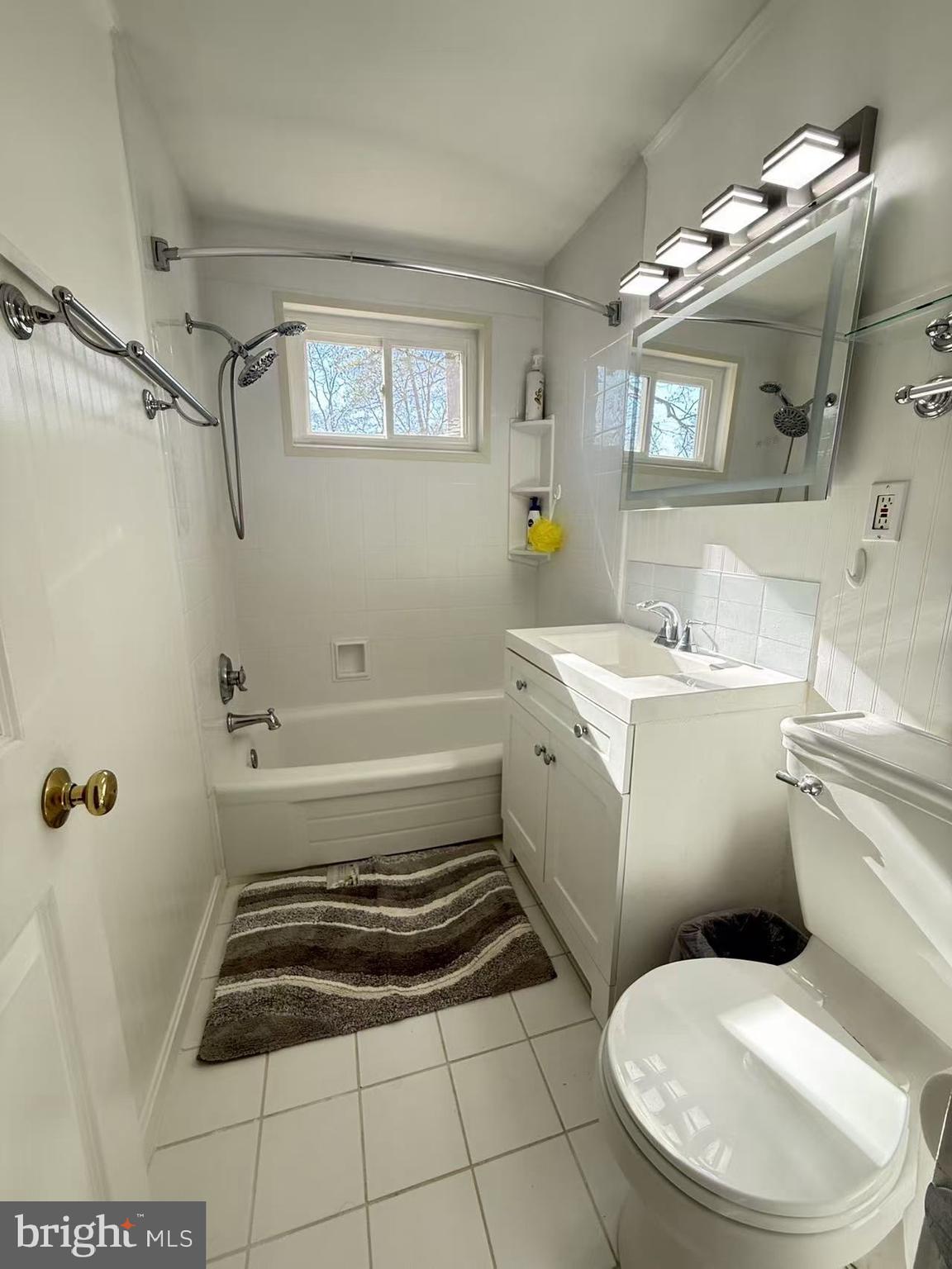 8621 Kenilworth Drive Springfield, VA 22151 - Photo 13 of 21 a bathroom with a sink toilet and shower