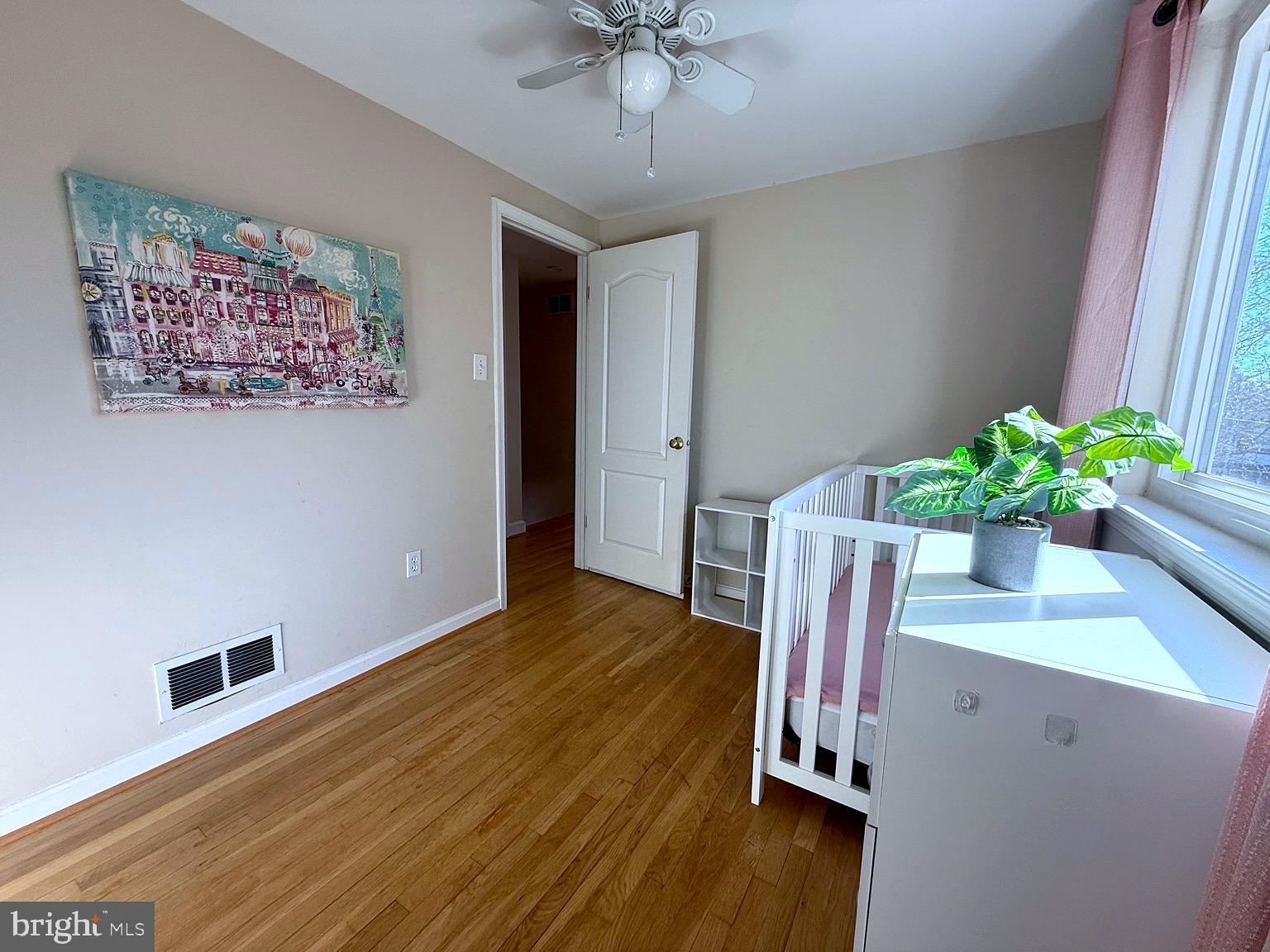 8621 Kenilworth Drive Springfield, VA 22151 - Photo 14 of 21 a view of a workspace with furniture and wooden floor