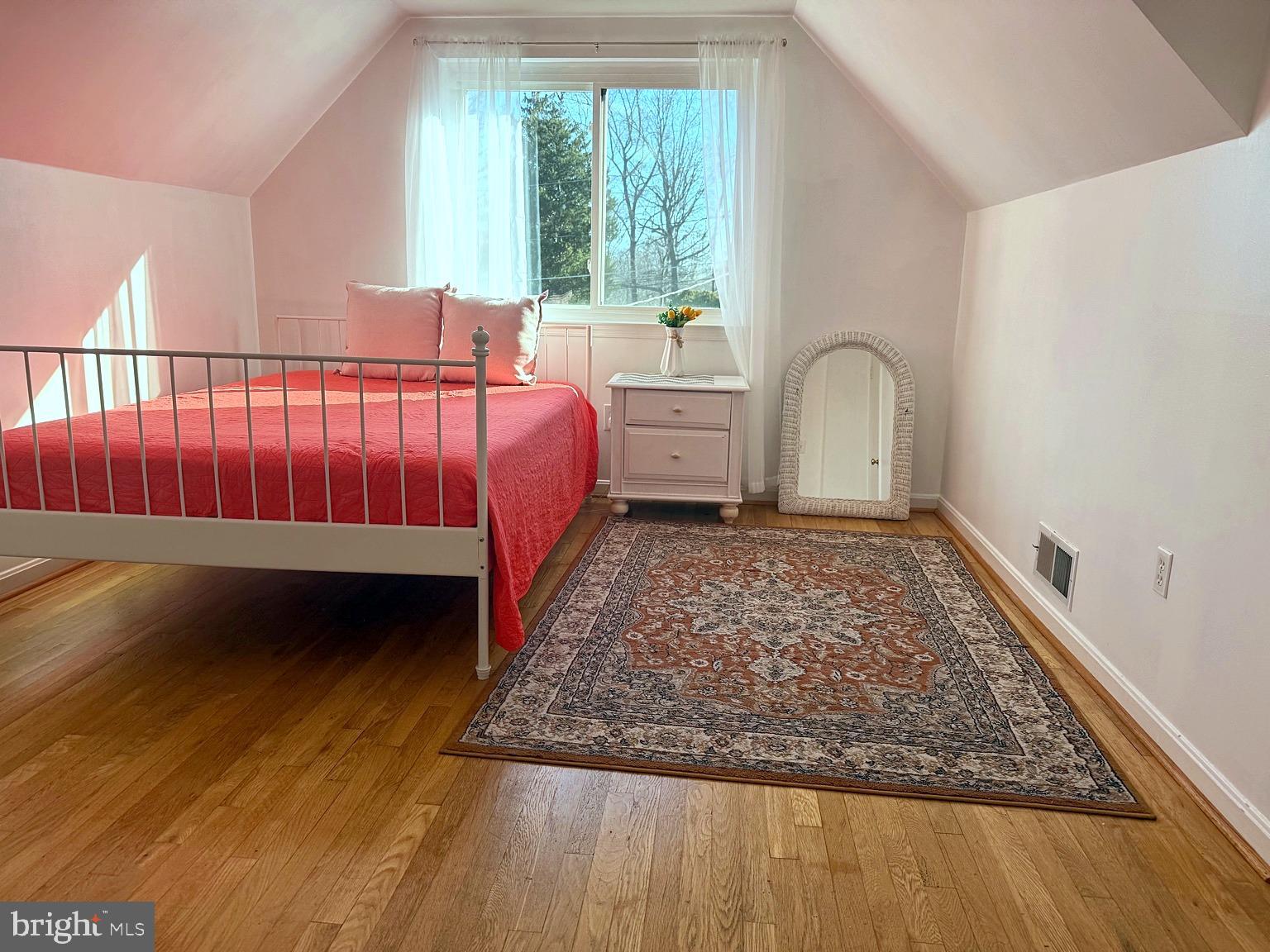 8621 Kenilworth Drive Springfield, VA 22151 - Photo 16 of 21 a bed sitting in a bedroom next to a window