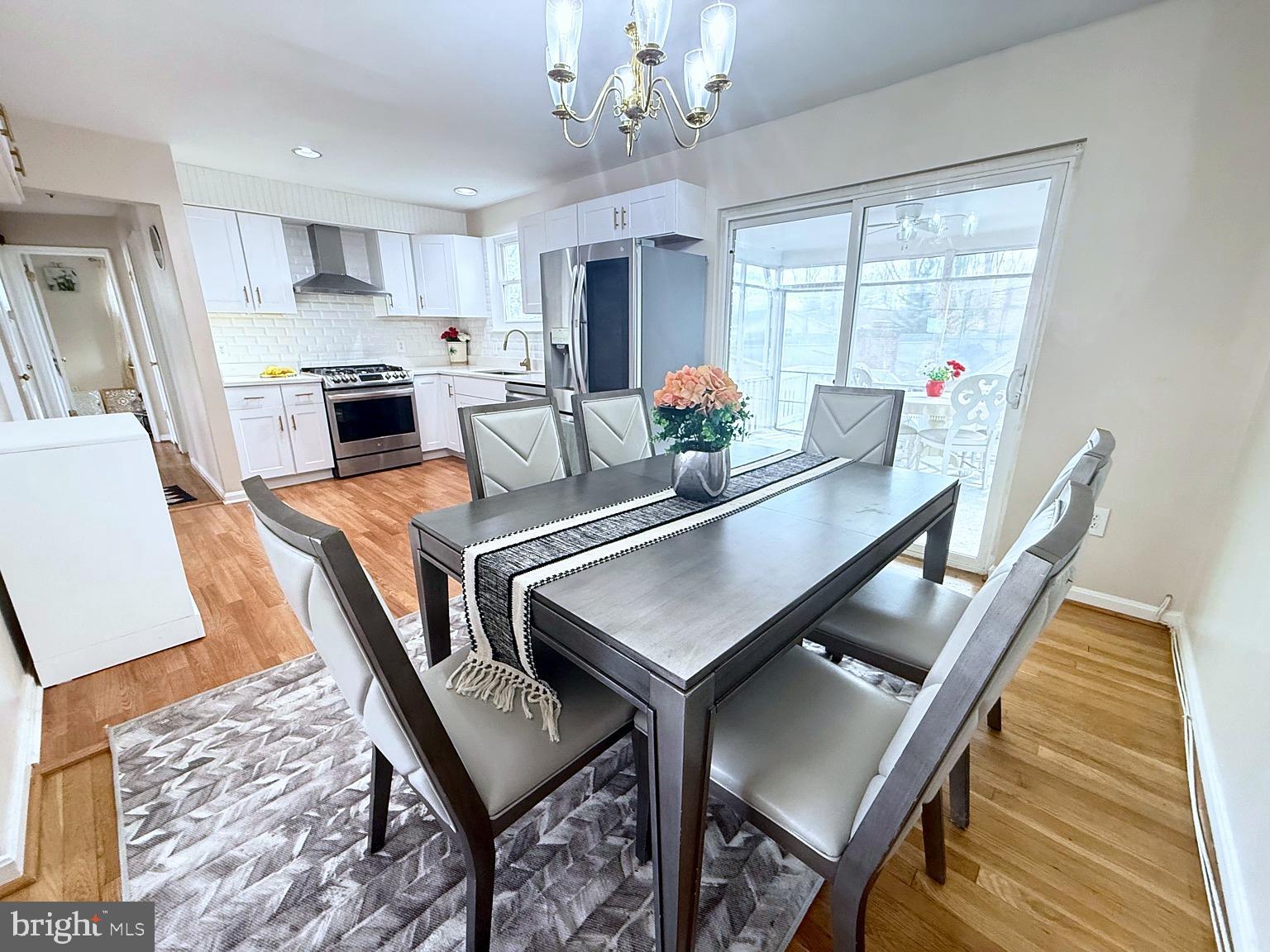 8621 Kenilworth Drive Springfield, VA 22151 - Photo 6 of 21 a view of a dining room with furniture window and wooden floor