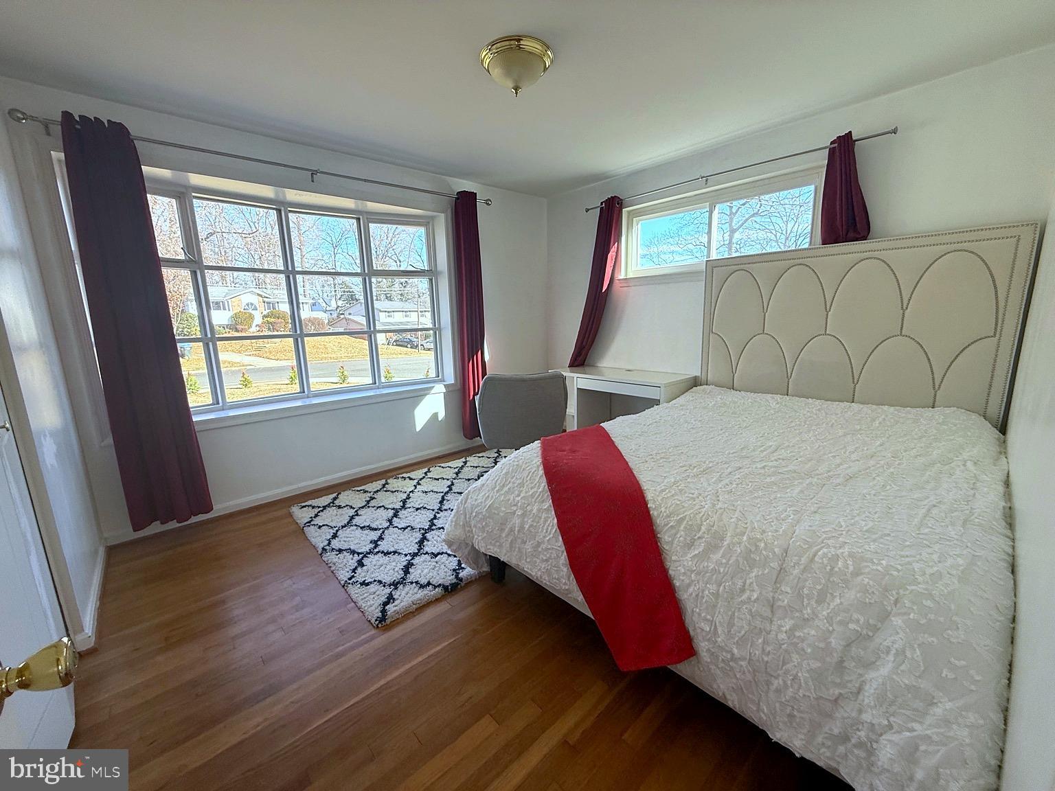 8621 Kenilworth Drive Springfield, VA 22151 - Photo 8 of 21 a bedroom with a large bed and a window