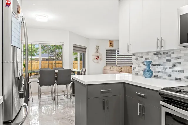 a kitchen with a sink and a stove