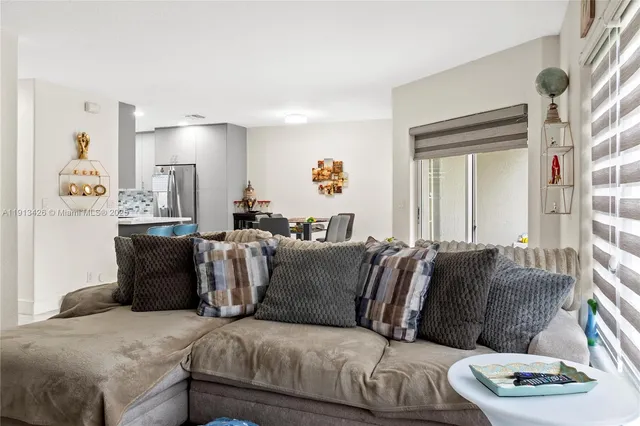 a living room with a couch and a window