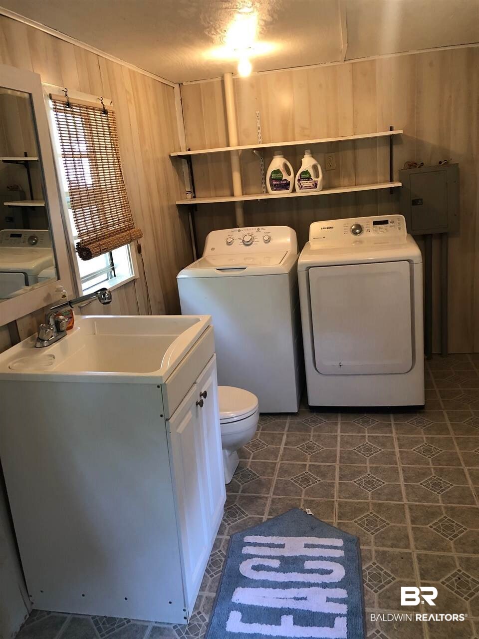 129 Defuniak Loop Lillian, AL 36549 - Photo 16 of 22 Shed/utility room with 1/