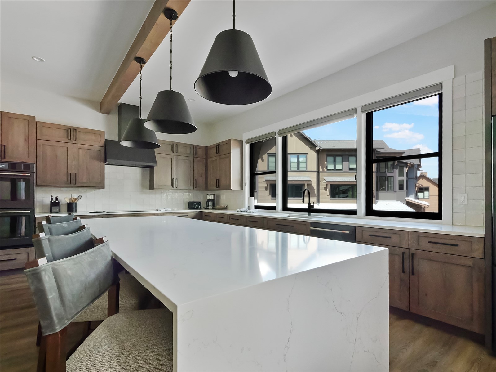 75 Alcove Court, Unit 75 Keystone, CO 80435 - Photo 6 of 40 a large kitchen with stainless steel appliances a large window and cabinets