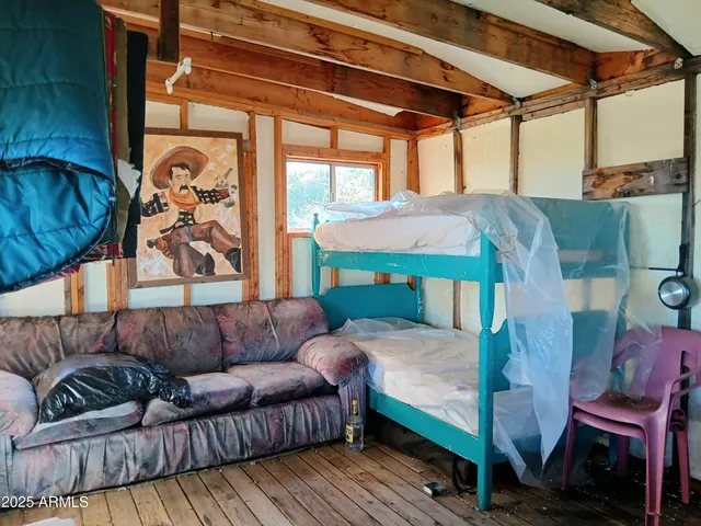 a view of a dining room with furniture and a window