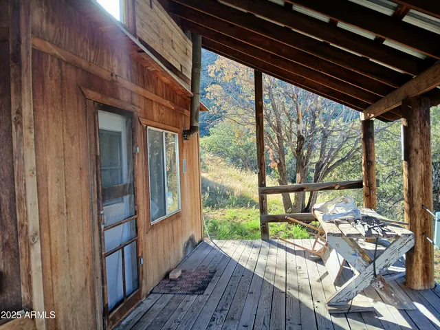 a view of balcony with wooden floor