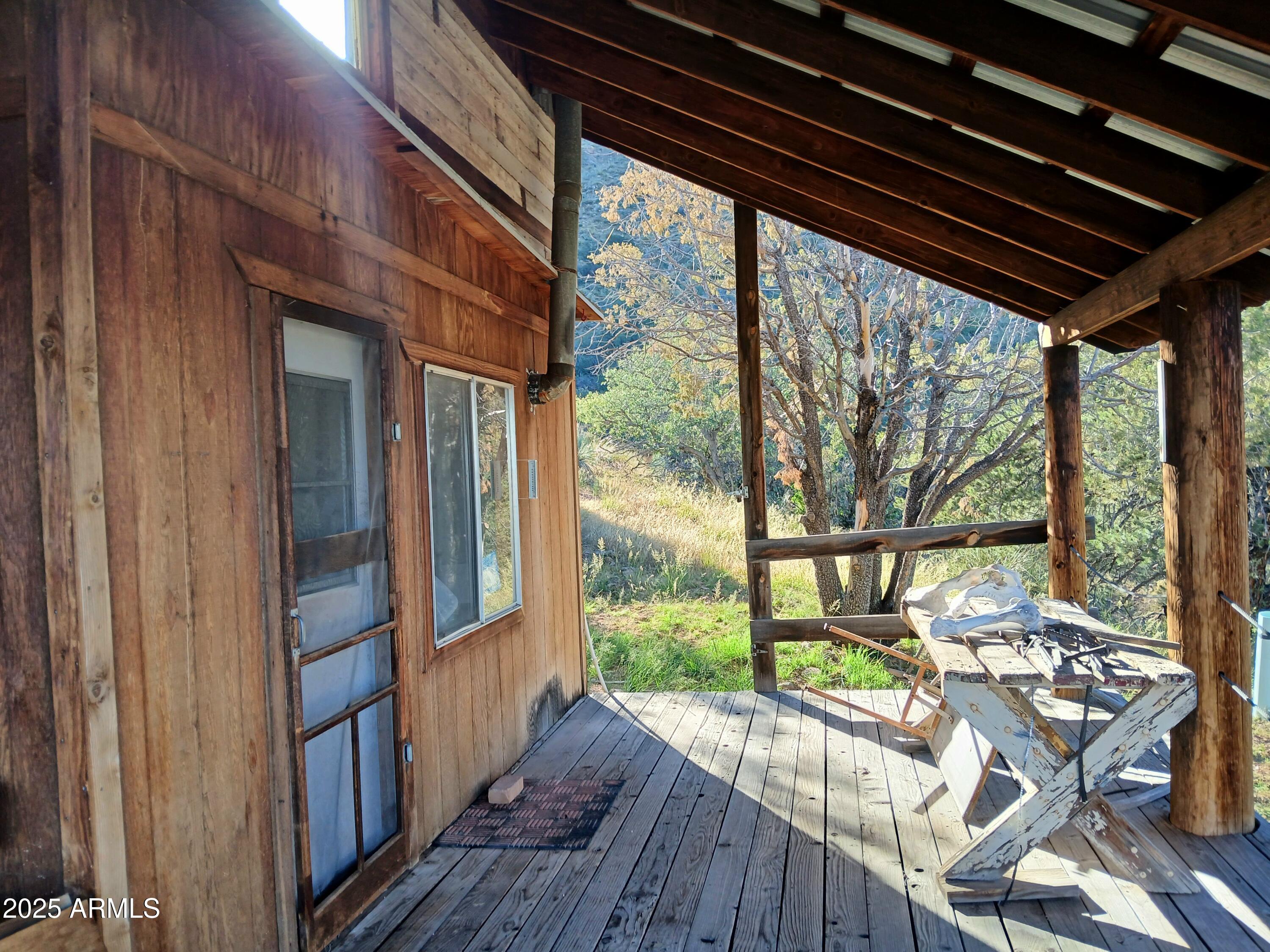 11699 North Last Chance Road Elfrida, AZ 85610 - Photo 2 of 39 a view of balcony with wooden floor