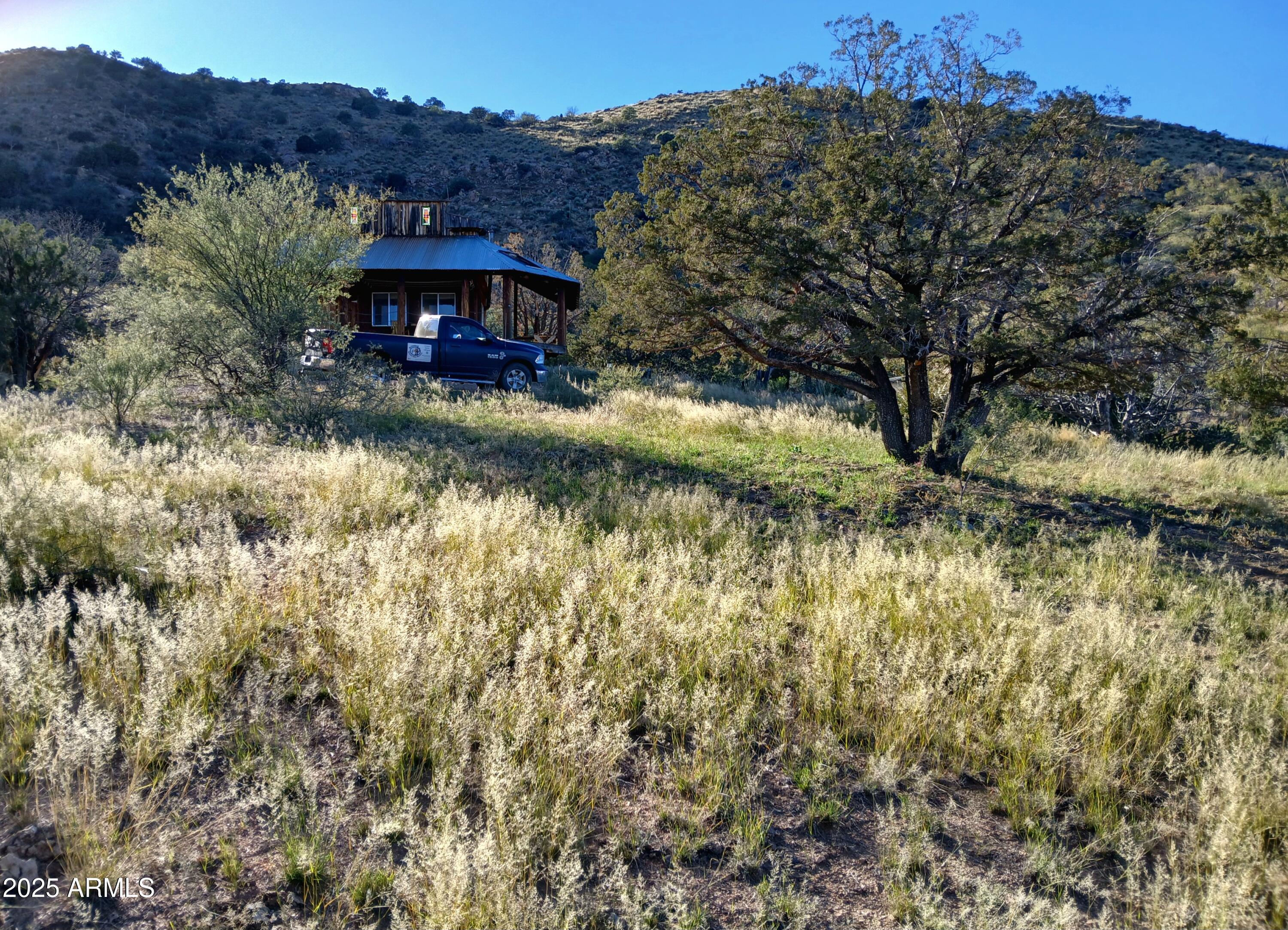 11699 North Last Chance Road Elfrida, AZ 85610 - Photo 21 of 39 a view of a town with mountains in the background