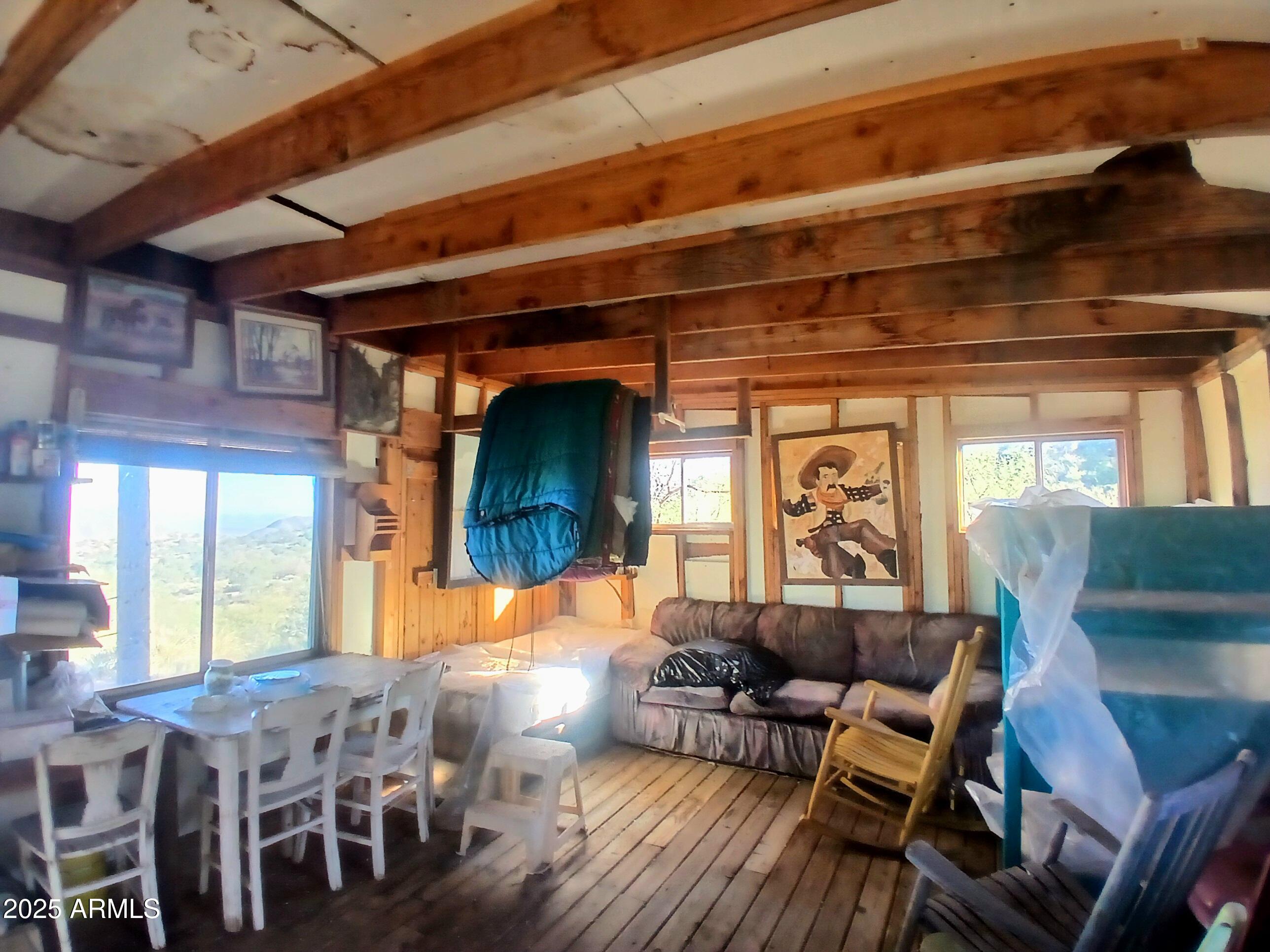 11699 North Last Chance Road Elfrida, AZ 85610 - Photo 10 of 39 a living room with furniture and a large window