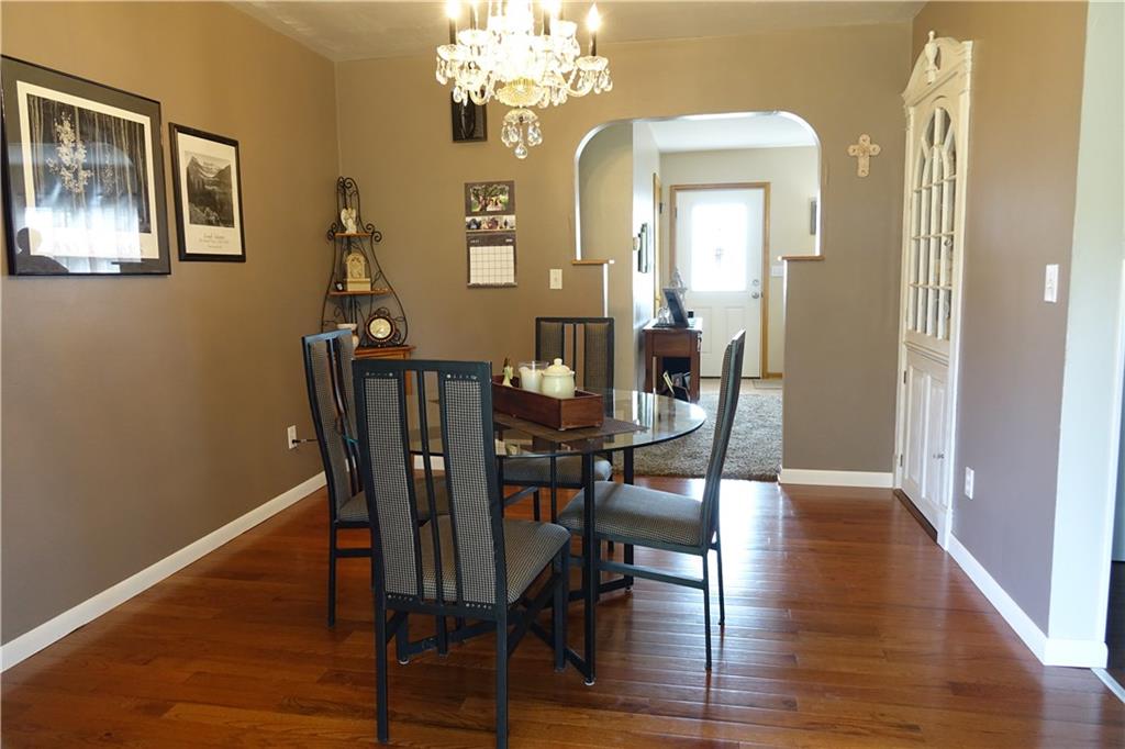 99 Saxonburg Road Butler, PA 16002 - Photo 8 of 25 Formal Dining Room with new hardwood flooring and glass doors which lead to a tranquil covered rear patio