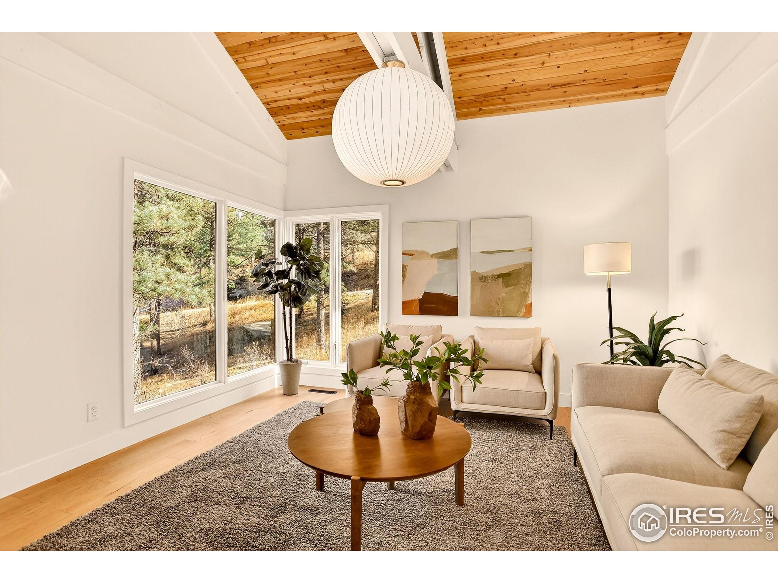 1138 Timber Lane Boulder, CO 80304 - Photo 13 of 21 a living room with furniture and a large window
