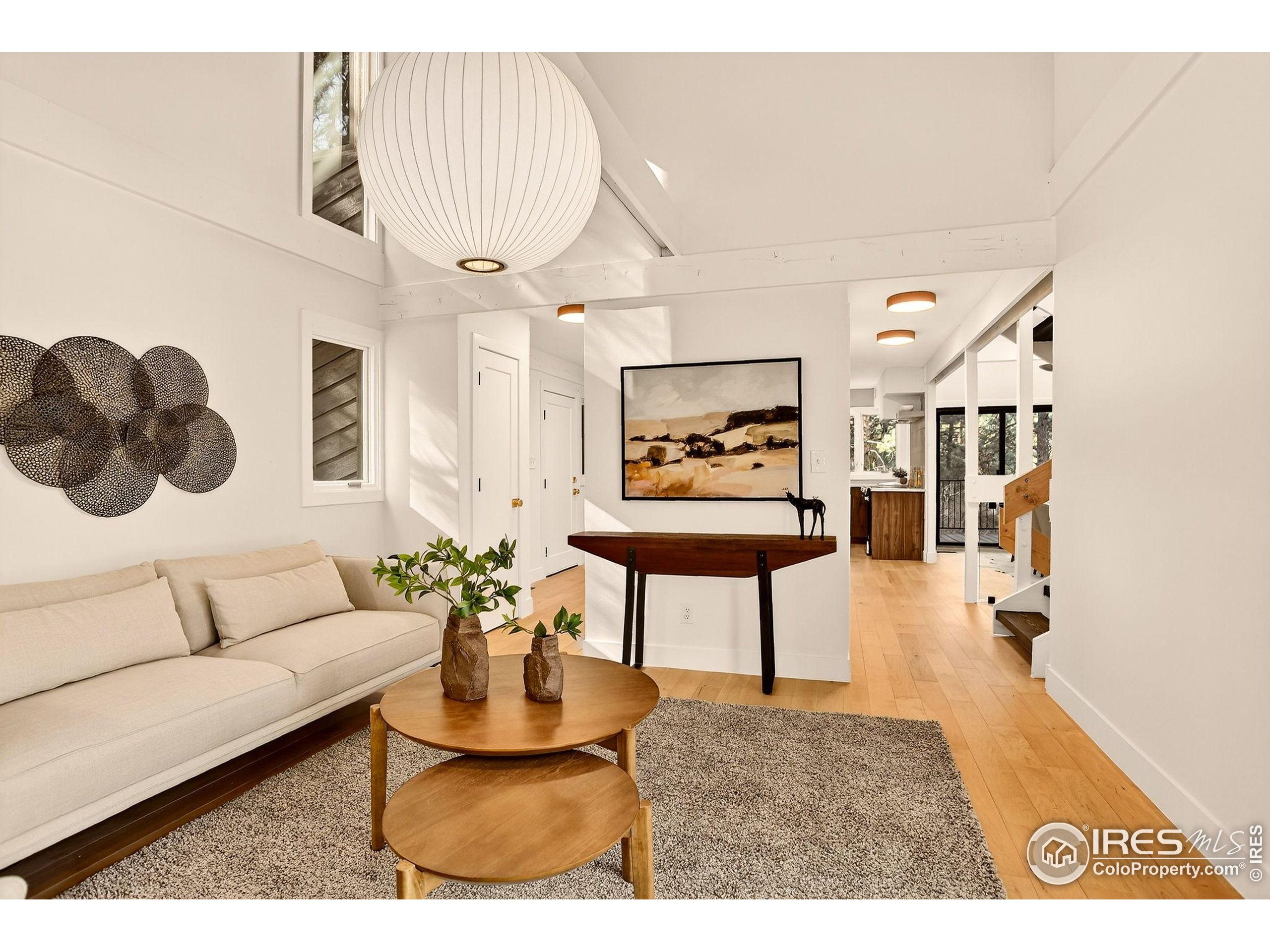 1138 Timber Lane Boulder, CO 80304 - Photo 14 of 21 a living room with furniture and a chandelier