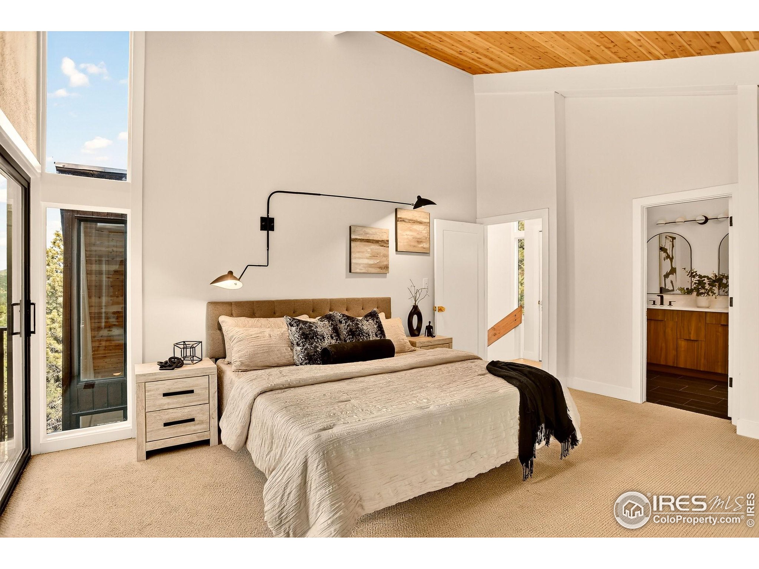 1138 Timber Lane Boulder, CO 80304 - Photo 15 of 21 a bedroom with a bed and a cabinets
