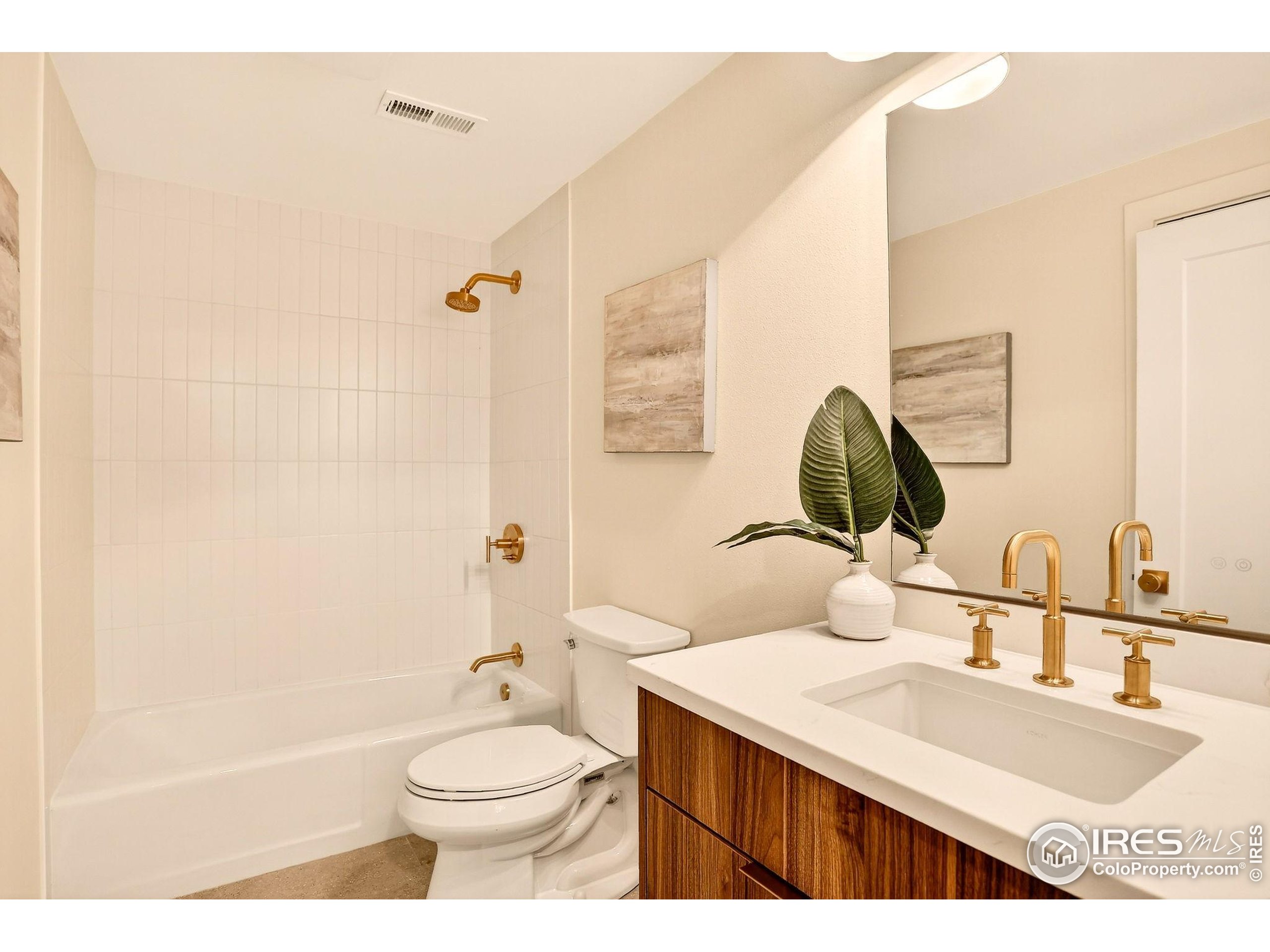 1138 Timber Lane Boulder, CO 80304 - Photo 18 of 21 a bathroom with a granite countertop sink toilet and shower
