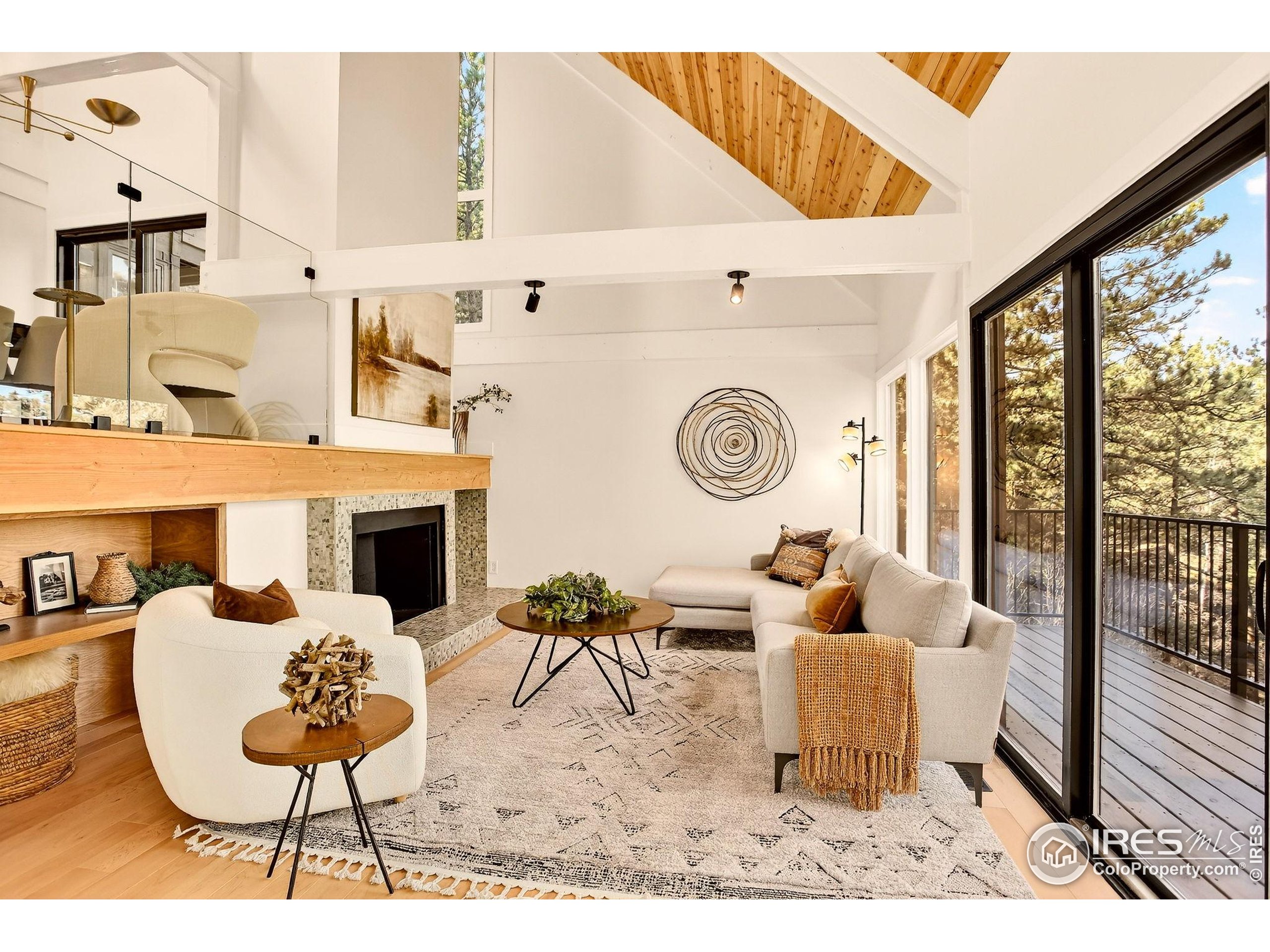 1138 Timber Lane Boulder, CO 80304 - Photo 2 of 21 a living room with furniture a rug and white walls