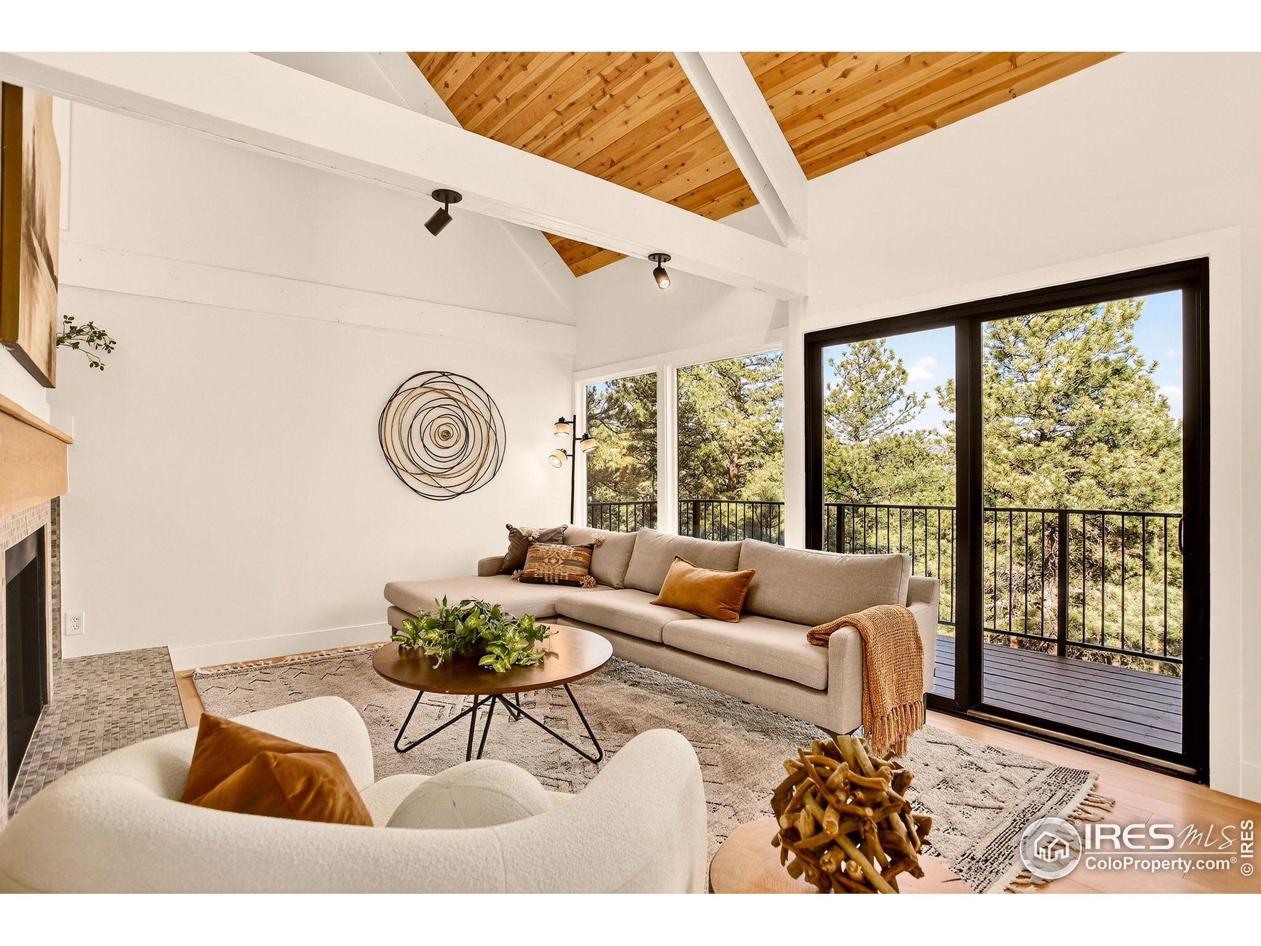 1138 Timber Lane Boulder, CO 80304 - Photo 9 of 21 a living room with furniture and a large window