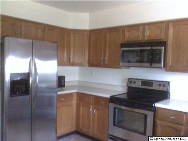 5A Alpine Road, Unit B Whiting, NJ 08759 - Photo 2 of 3 a kitchen with cabinets and steel stainless steel appliances