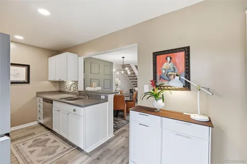 a kitchen with stainless steel appliances a sink and a stove top oven