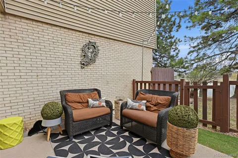 a view of a chairs with a table in the patio