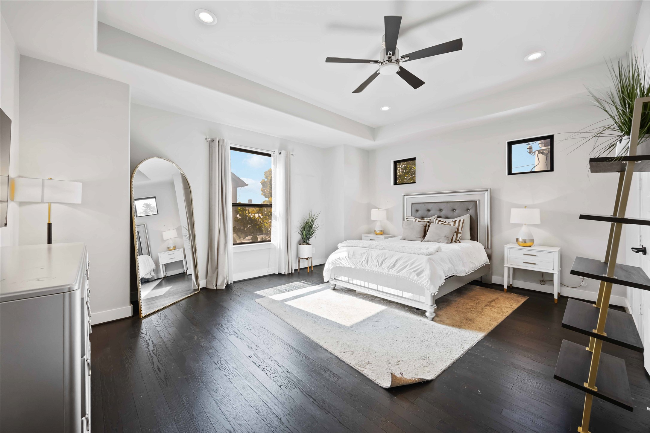 4235 Allen Street Houston, TX 77007 - Photo 12 of 23 a bedroom with a large bed and a chandelier