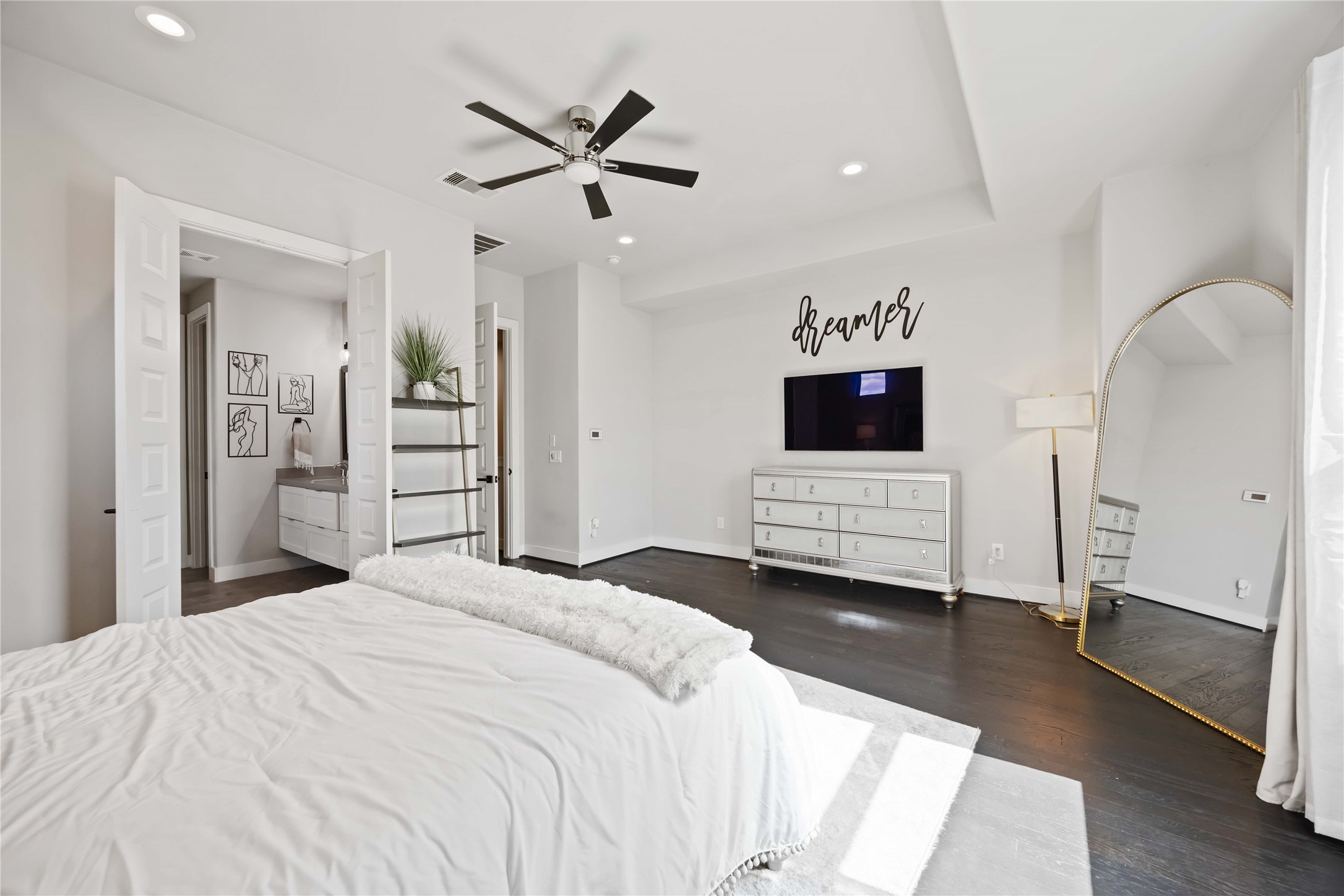 4235 Allen Street Houston, TX 77007 - Photo 13 of 23 a bedroom with a bed and a flat screen tv