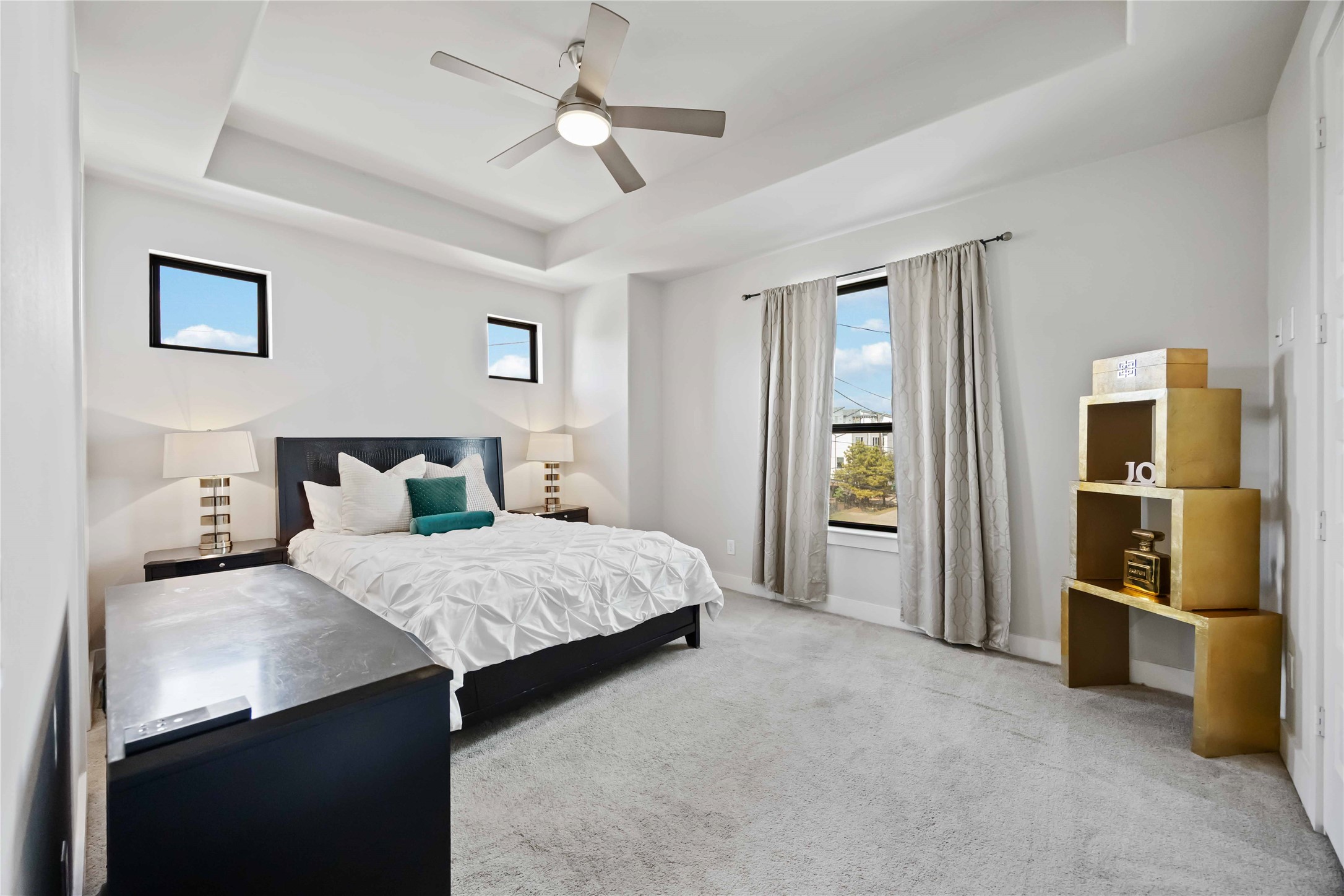 4235 Allen Street Houston, TX 77007 - Photo 16 of 23 a bedroom with a large bed and a chandelier