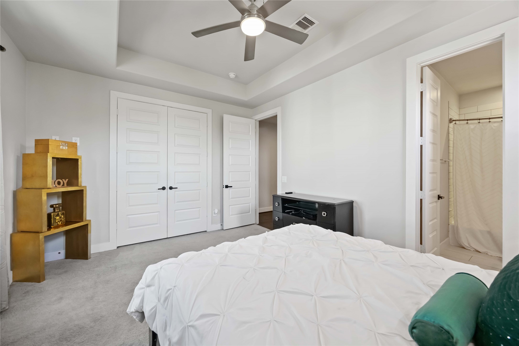 4235 Allen Street Houston, TX 77007 - Photo 17 of 23 a bedroom with a large bed and a chandelier